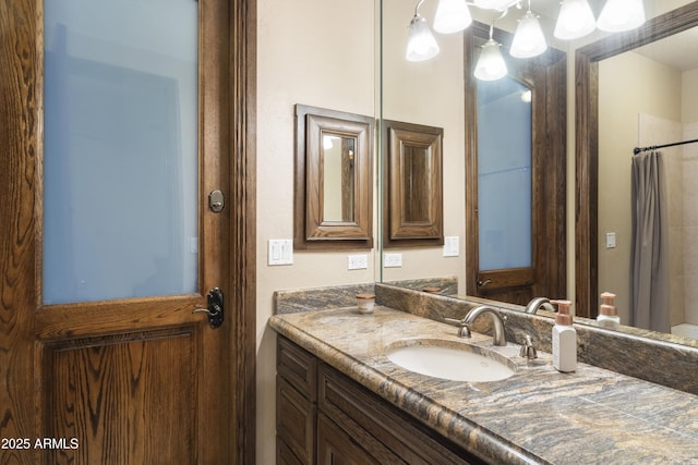 bathroom with vanity and a shower with shower curtain