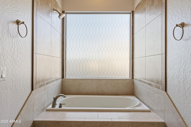 bathroom featuring a relaxing tiled tub