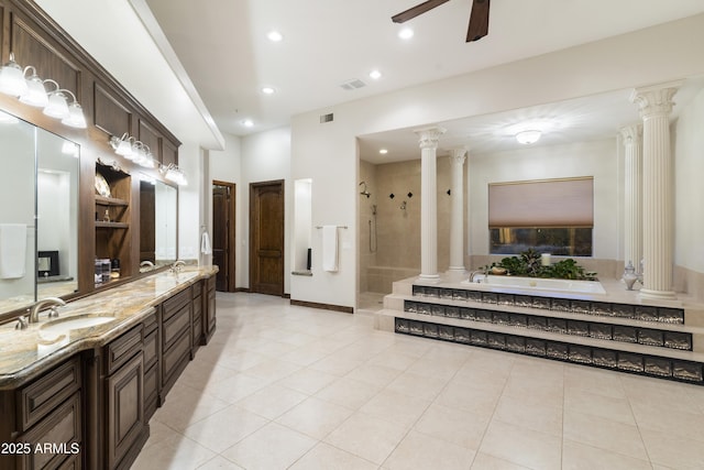 bathroom with tile patterned floors, vanity, independent shower and bath, ceiling fan, and decorative columns