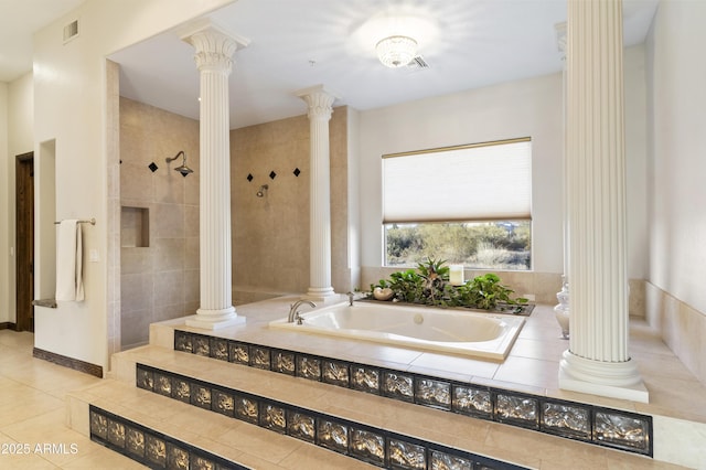 bathroom featuring plus walk in shower, tile patterned flooring, and decorative columns