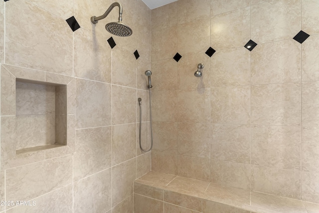 bathroom with tiled shower