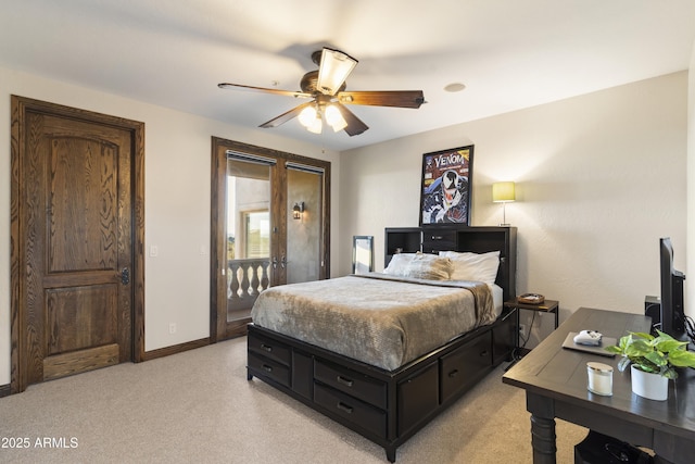 bedroom with ceiling fan and light carpet