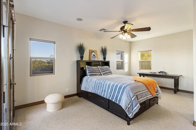 bedroom featuring light carpet and ceiling fan