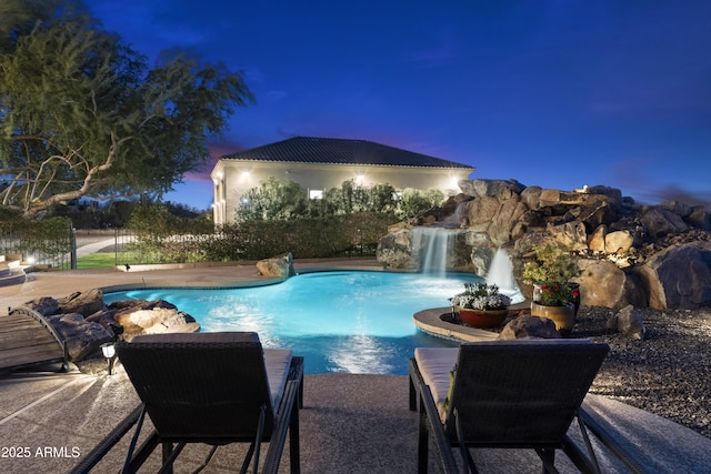 view of swimming pool featuring pool water feature