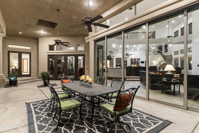 view of patio featuring ceiling fan and french doors