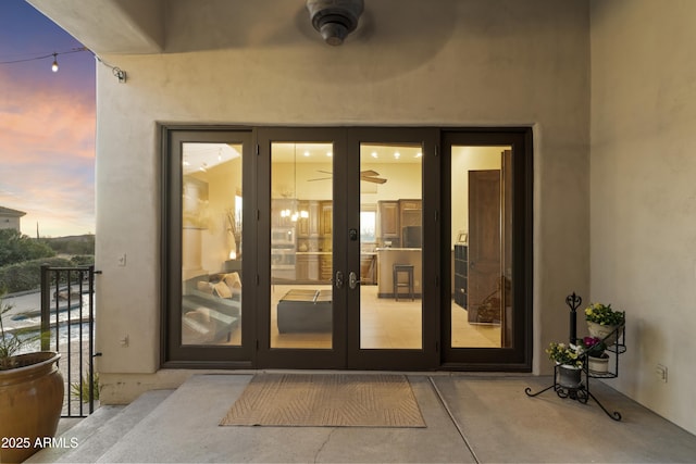 exterior entry at dusk with french doors