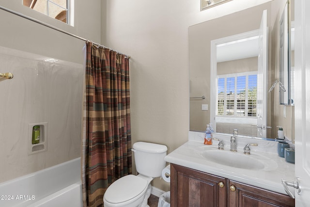 full bathroom featuring vanity, shower / bathtub combination with curtain, and toilet