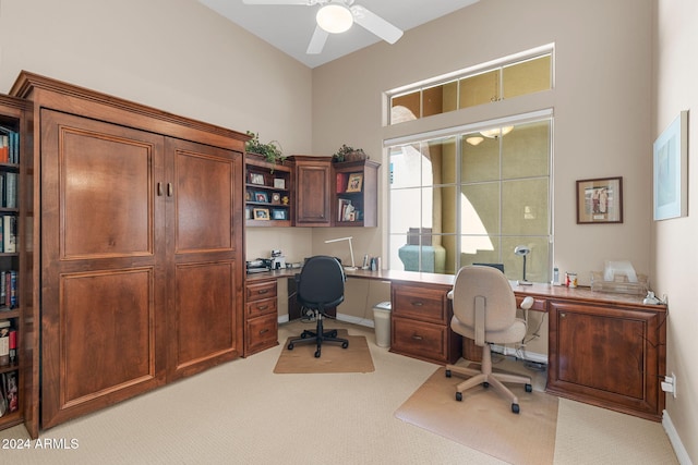 office featuring light carpet and ceiling fan