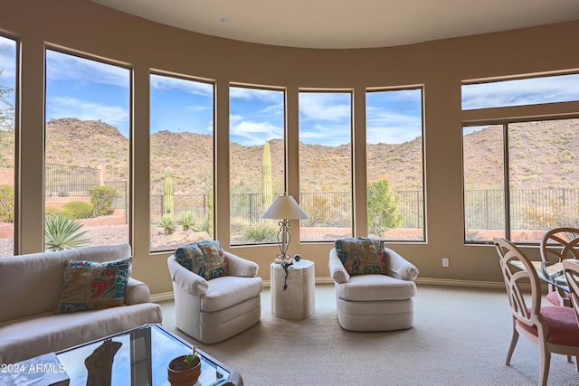 sunroom / solarium with a mountain view and a healthy amount of sunlight