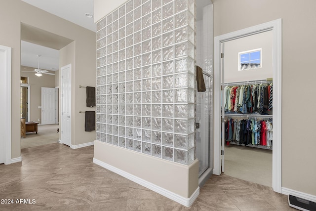 hallway featuring light colored carpet