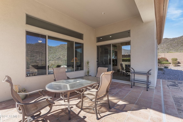 view of patio / terrace featuring a mountain view