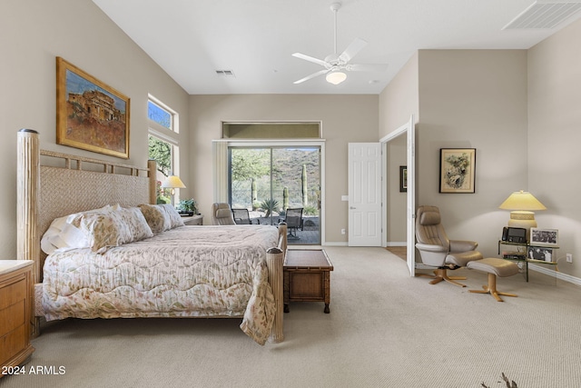 bedroom with access to outside, light carpet, and ceiling fan