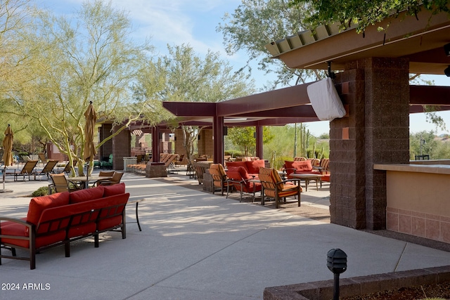 view of property's community featuring a patio and outdoor lounge area