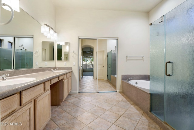 bathroom with tile patterned flooring, vanity, and independent shower and bath