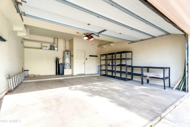 garage featuring a garage door opener and water heater