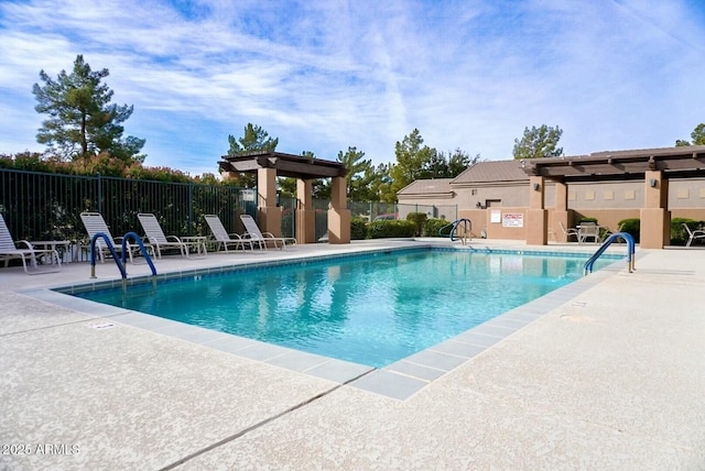 view of swimming pool with a patio area