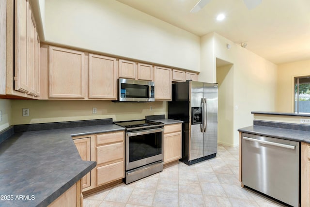 kitchen with stainless steel appliances and light brown cabinets