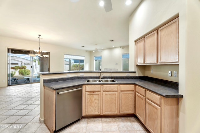 kitchen featuring pendant lighting, sink, stainless steel dishwasher, kitchen peninsula, and light brown cabinets