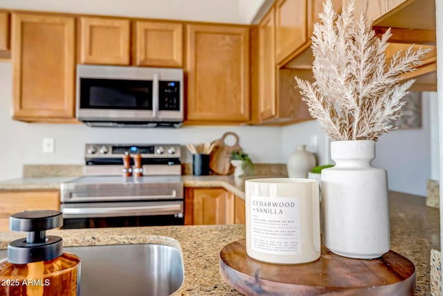 10215 W Missouri Ave, Glendale, AZ 85307 - kitchen featuring electric range and light stone countertops