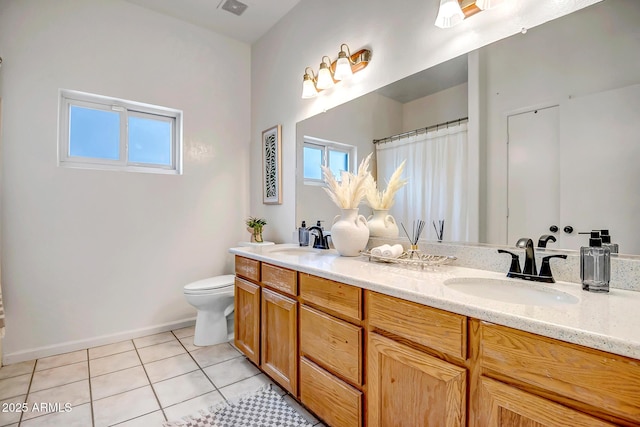10215 W Missouri Ave, Glendale, AZ 85307 - bathroom with toilet, tile patterned floors, double vanity, and baseboards