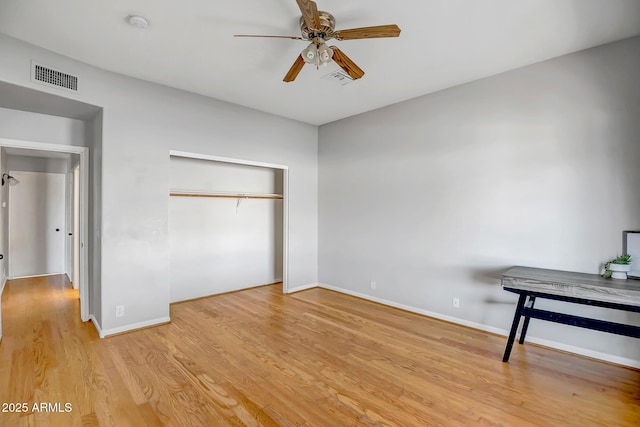 10215 W Missouri Ave, Glendale, AZ 85307 - unfurnished bedroom featuring a closet, wood finished floors, baseboards, and ceiling fan