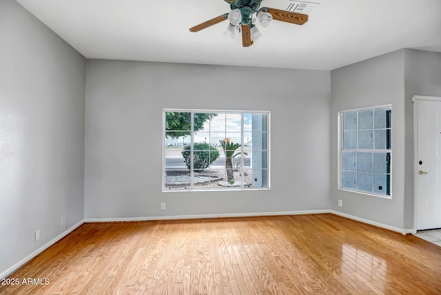 10215 W Missouri Ave, Glendale, AZ 85307 - spare room featuring wood finished floors, ceiling fan, and baseboards