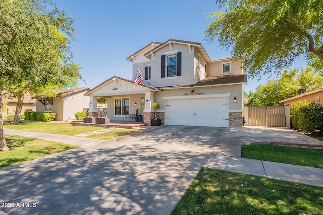 craftsman house featuring a garage, a porch, driveway, stone siding, and a gate
