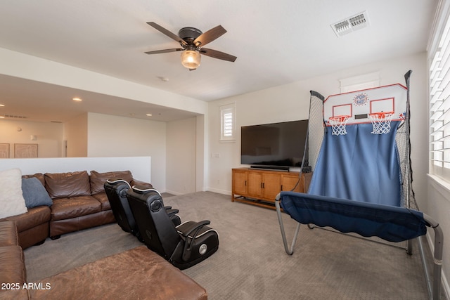 living area with carpet, ceiling fan, baseboards, and recessed lighting