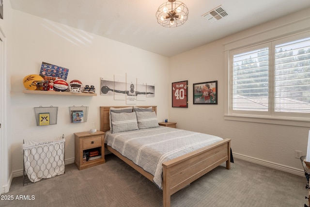 carpeted bedroom with baseboards