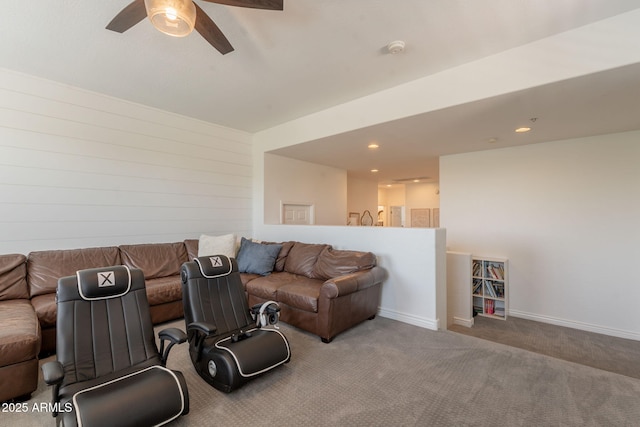 carpeted living room with a ceiling fan and recessed lighting