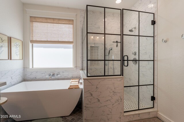 full bath featuring a freestanding bath and a stall shower