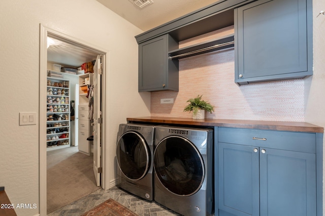 laundry area with cabinet space, independent washer and dryer, and carpet
