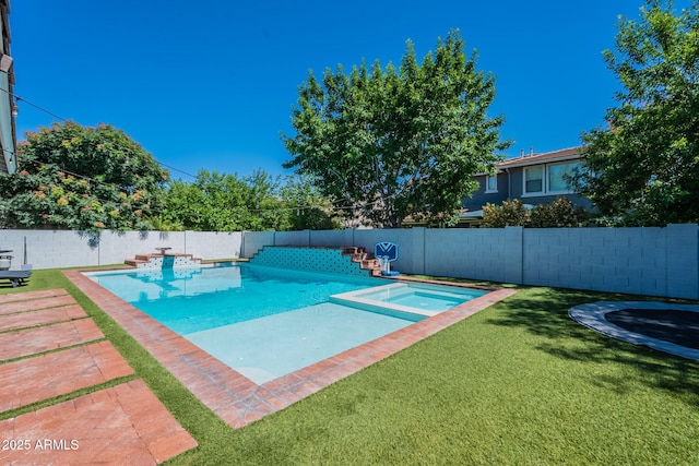 view of swimming pool featuring a pool with connected hot tub, a patio area, and a trampoline