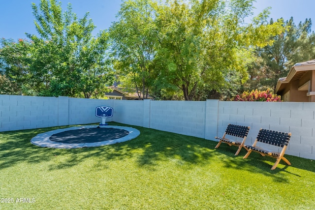 view of yard featuring a trampoline