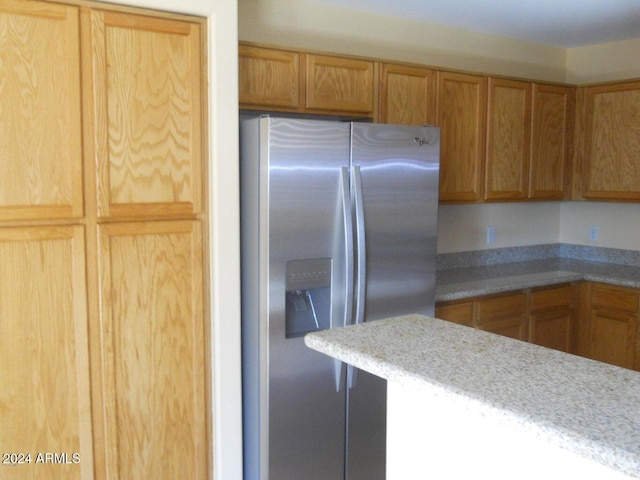 kitchen with stainless steel refrigerator with ice dispenser