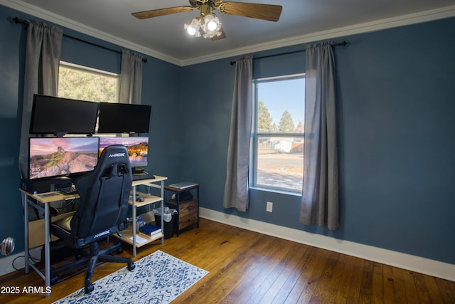 home office featuring hardwood / wood-style floors, crown molding, baseboards, and a wealth of natural light