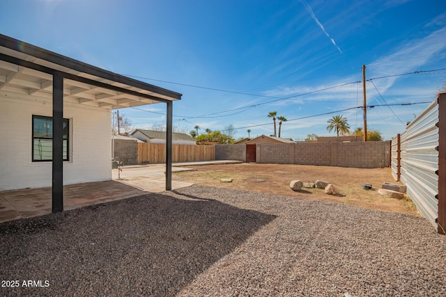 view of yard featuring a fenced backyard and a patio