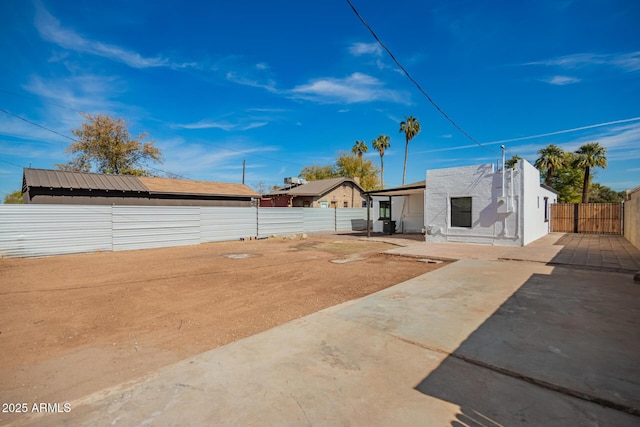 view of yard with a patio area and a fenced backyard