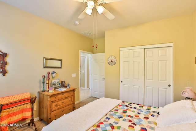 bedroom featuring baseboards, a closet, visible vents, and a ceiling fan