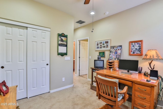 home office featuring light colored carpet, visible vents, ceiling fan, and baseboards