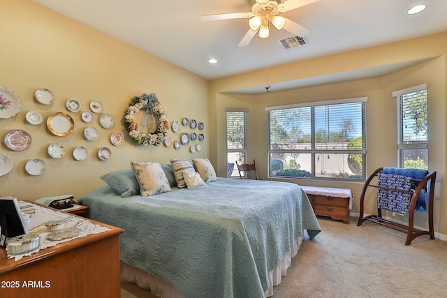 bedroom featuring recessed lighting, baseboards, visible vents, and light colored carpet