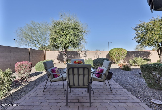 view of patio featuring a fenced backyard