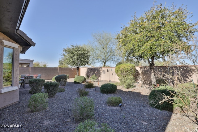 view of yard featuring a patio area and a fenced backyard