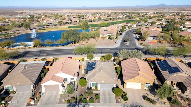 birds eye view of property with a water view and a residential view