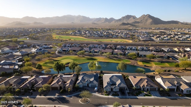 birds eye view of property with a water and mountain view and a residential view