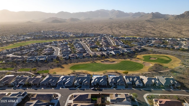 drone / aerial view featuring a mountain view, golf course view, and a residential view