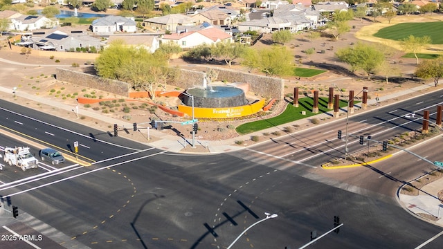 birds eye view of property with a residential view