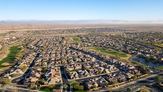 drone / aerial view featuring a residential view and a mountain view