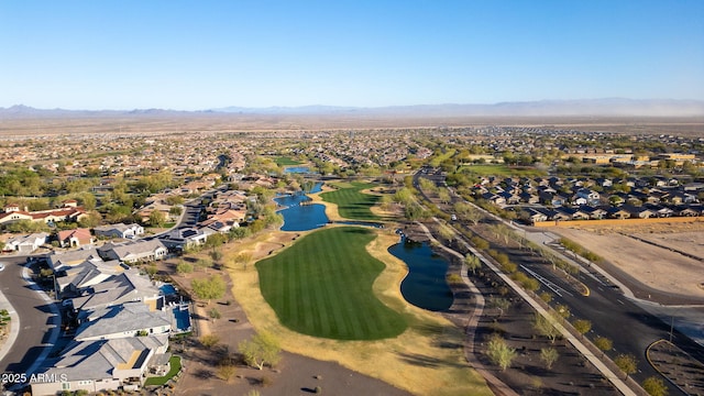 birds eye view of property featuring a residential view, view of golf course, and a water and mountain view