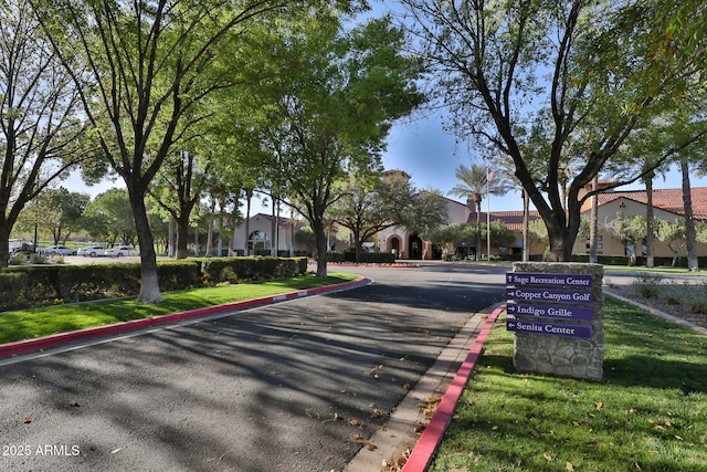 view of street with a residential view and curbs